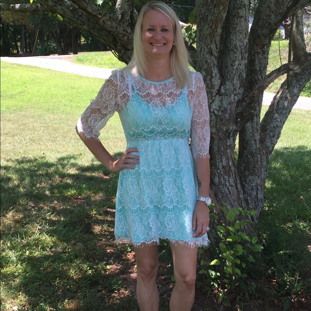 Women’s white lace dress with turquoise slip
